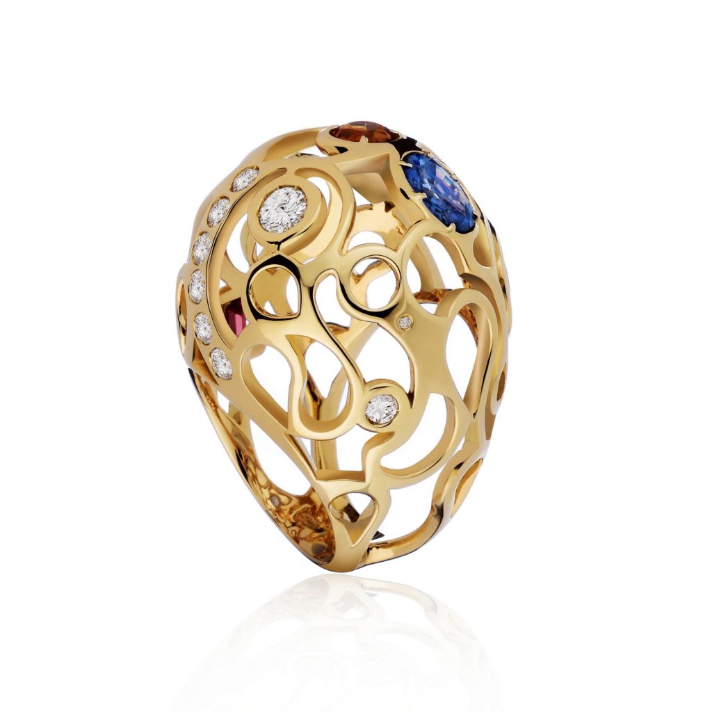 Kashmir ring. Blue Sapphire, Diamonds, Imperial Topaz, red Garnet